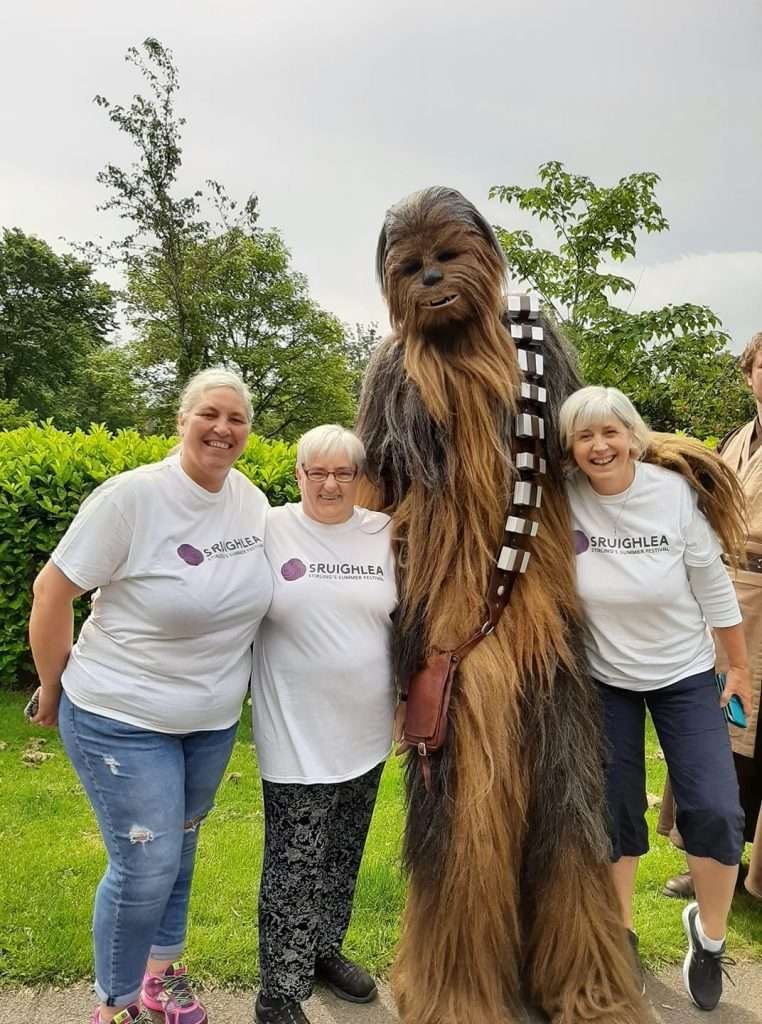 group of women with chewbacca from star wars